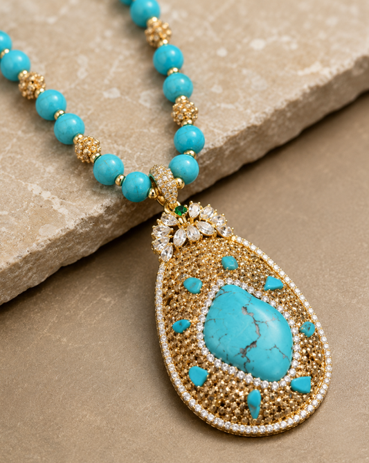 Close-up of vintage turquoise necklace featuring soft blue-green gemstone pendant