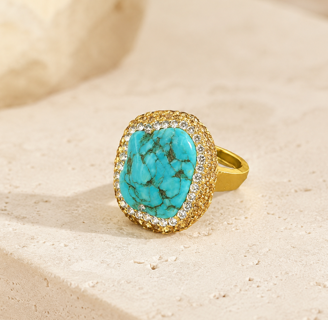 Elegant pearl turquoise jewelry displayed on natural stone with coastal colors, soft shadows, and refined styling.