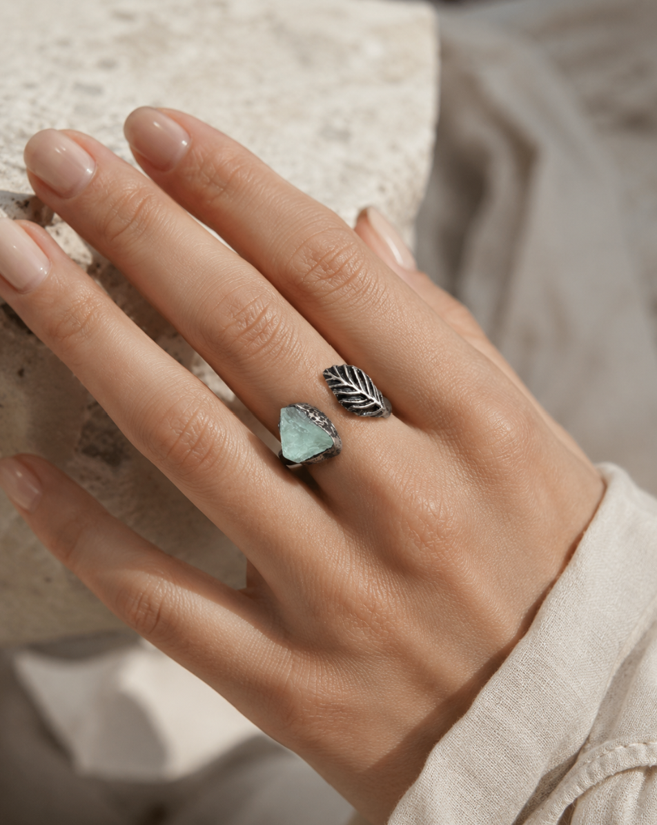 Fresh green feather ring inspired by nature inspired feather ring styling and delicate crystal beauty.