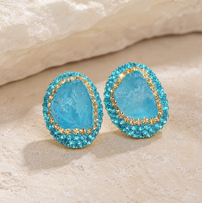 Side view of aquamarine birthstone jewelry catching gentle reflections
