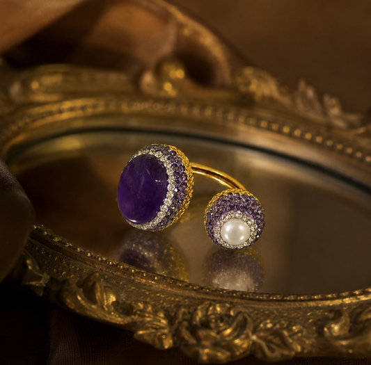 Close-up of baroque pearl ring featuring the Eternal Amethyst Whisper design