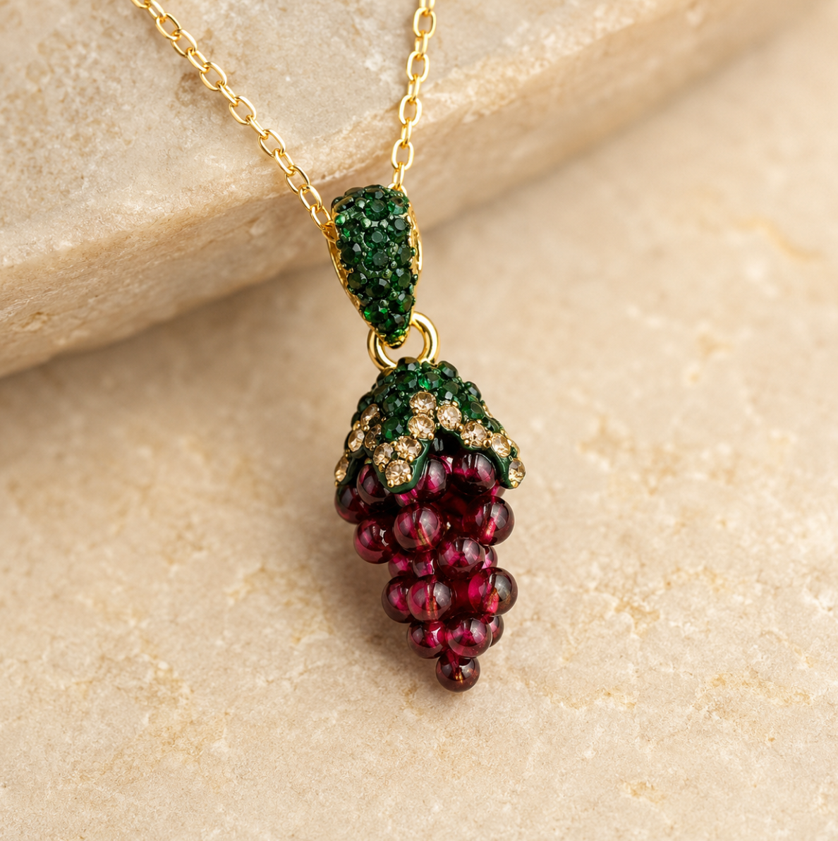 Garnet necklace with natural garnet stones resting on vintage silk