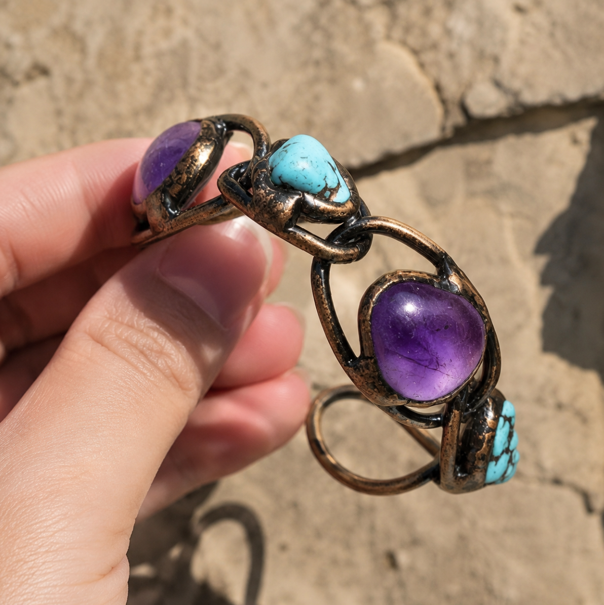 Amethyst turquoise bracelet with purple amethyst stones, turquoise accents, and sculptural vintage-style curves.