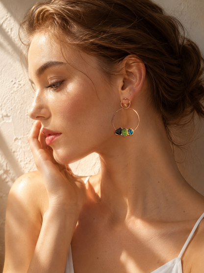 Green fluorite earrings with blue apatite and garnet stones in a delicate hoop drop design.