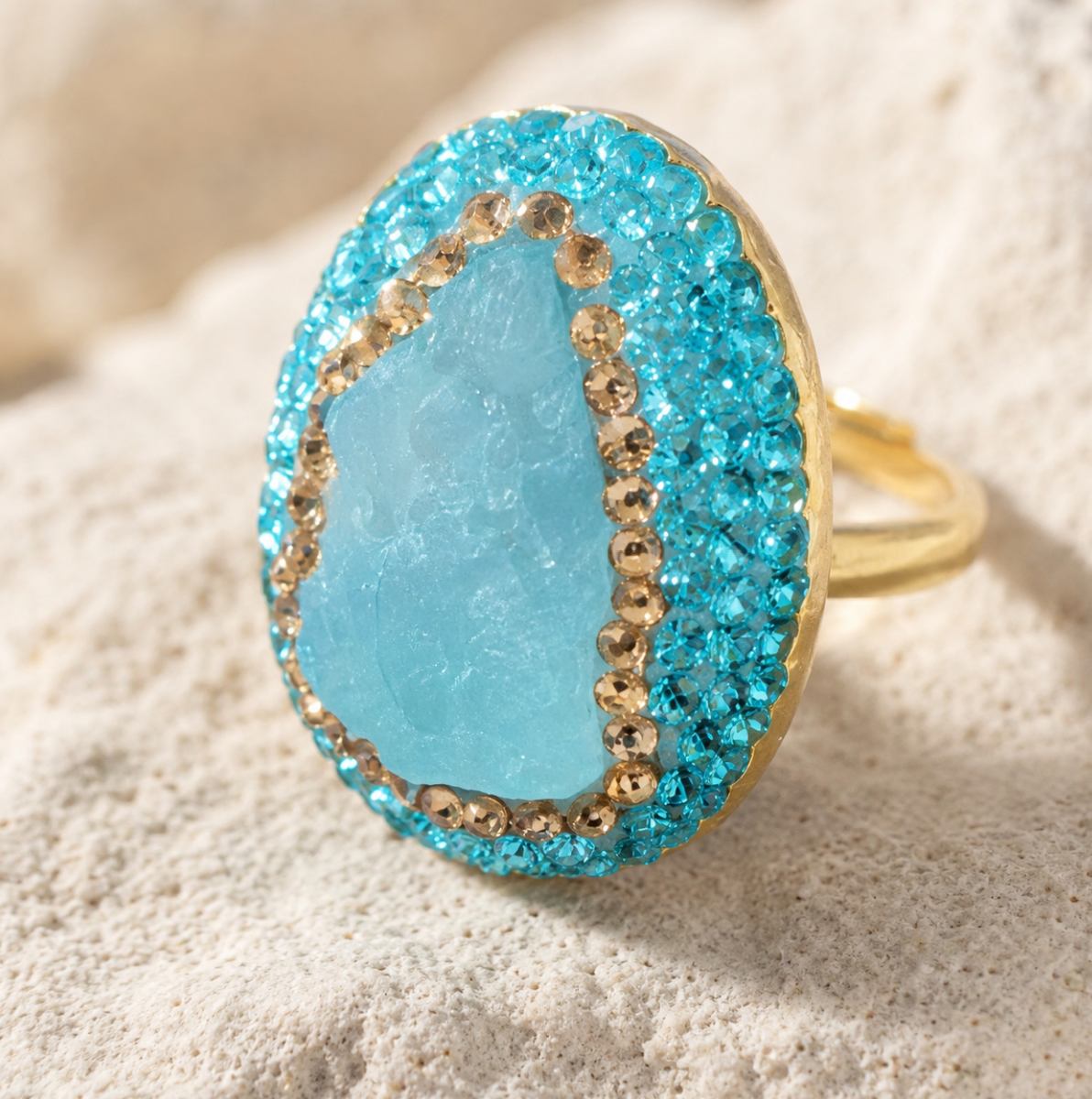 Close-up of raw gemstone jewelry highlighting natural aquamarine texture