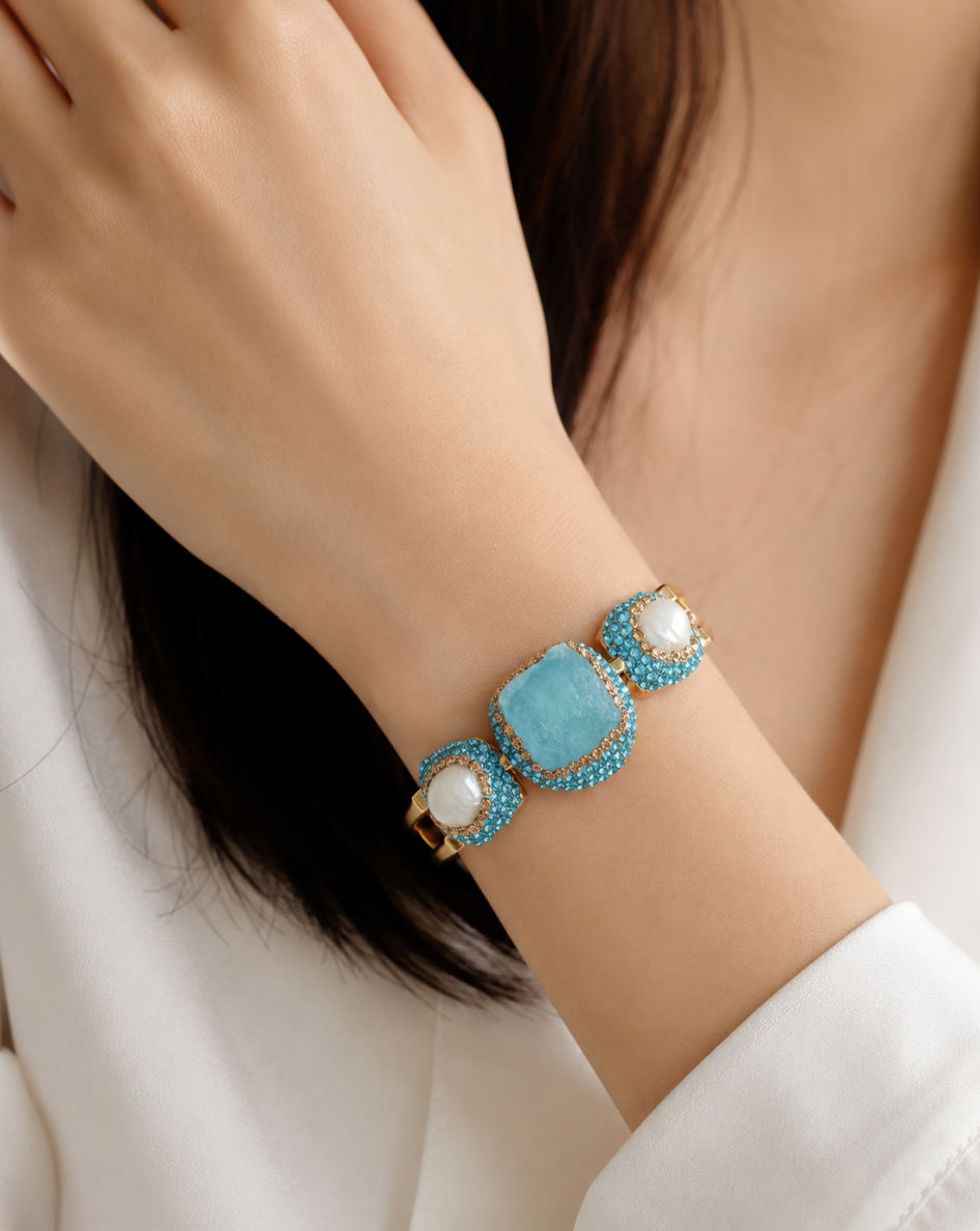 Full aquamarine jewelry set displayed with soft natural light and delicate pearls