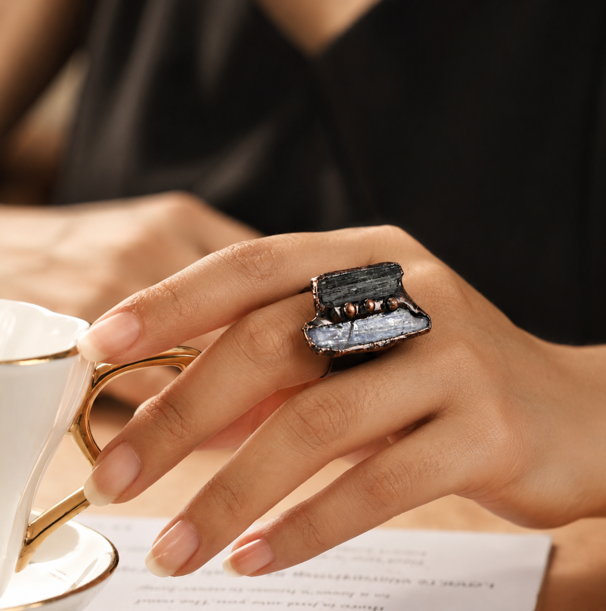 Color blocked gemstone ring with blue quartz ring feeling and green tourmaline jewelry character.