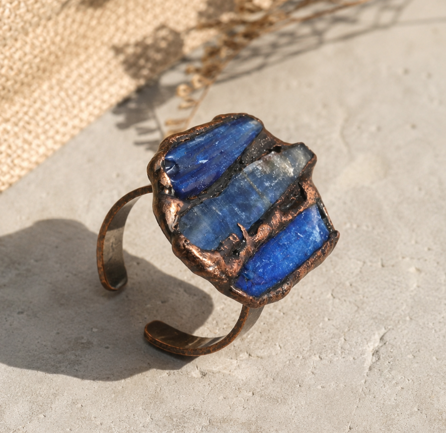 Multi stone gemstone ring featuring raw blue kyanite crystals, handcrafted texture, and earthy styling.