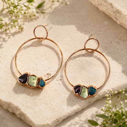 Multi gemstone earrings featuring green, blue, and deep red stones with organic handmade texture.