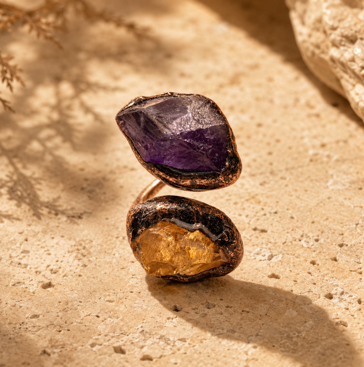 Amethyst citrine ring with raw purple amethyst, golden citrine stone, and sculptural open-band design.