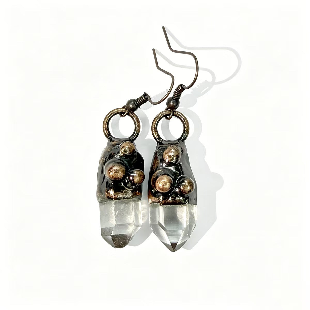 Geometric crystal earrings with six sided crystal earrings shape and quiet modern jewelry mood.