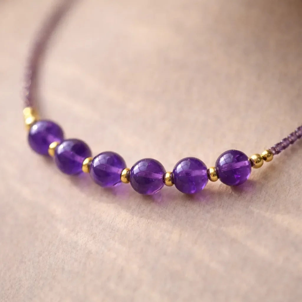 february birthstone necklace with small amethyst beads and refined detail