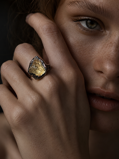 Citrine jewelry ring with raw golden crystal face, sculptural presence, and quiet statement style.