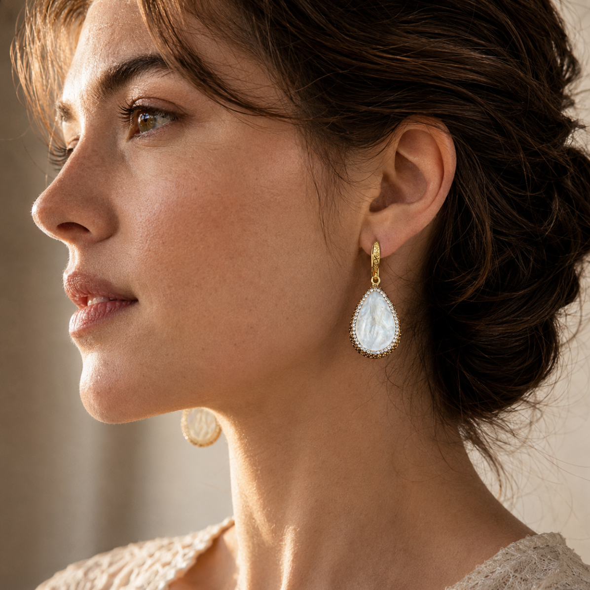 Elegant seashell pearl earrings styled with a soft ocean-inspired drop shape and feminine summer mood.