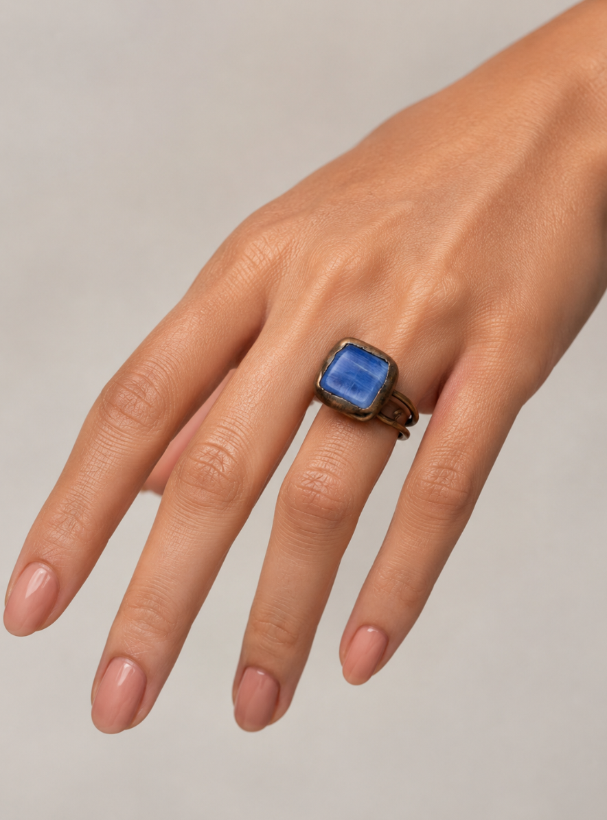 Boho blue ring with blue birthstone ring mood, artistic shape, and deep ocean-like color.
