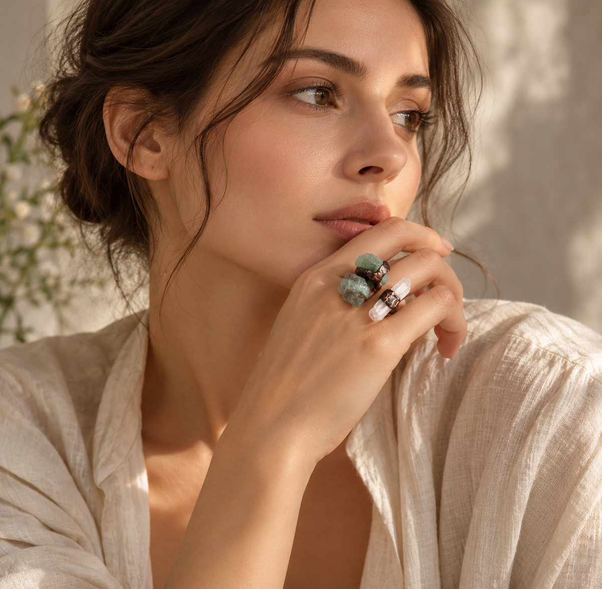 Statement ring worn with a cream outfit, showing the scale and color contrast of its three raw stones.