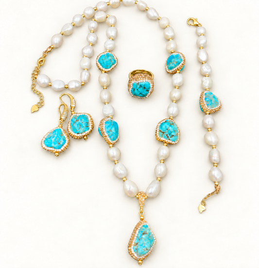 Coastal turquoise jewelry set with baroque pearl necklace, bracelet, earrings and ring on an off-white background