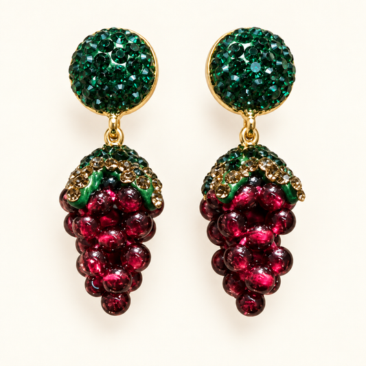 Pair of green-stud garnet earrings with burgundy grape-cluster drops on an off-white background