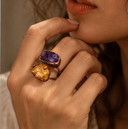 Two stone ring worn on the finger, showing the real scale of the amethyst, citrine, and open band design.