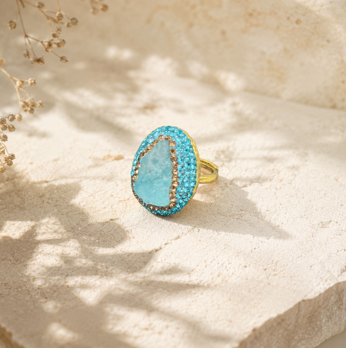Close-up of raw gemstone jewelry highlighting natural aquamarine texture