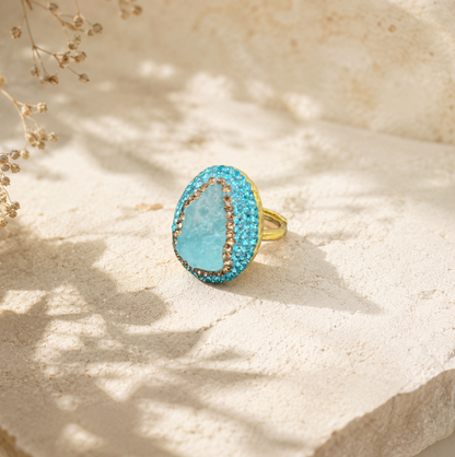Close-up of raw gemstone jewelry highlighting natural aquamarine texture