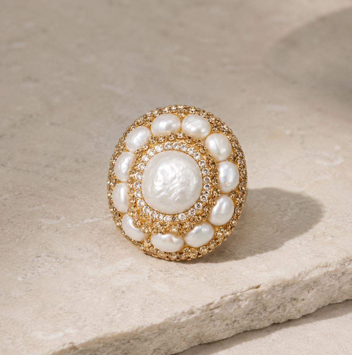 Elegant natural baroque pearl ring featuring an irregular pearl shape, golden texture, and refined feminine styling.
