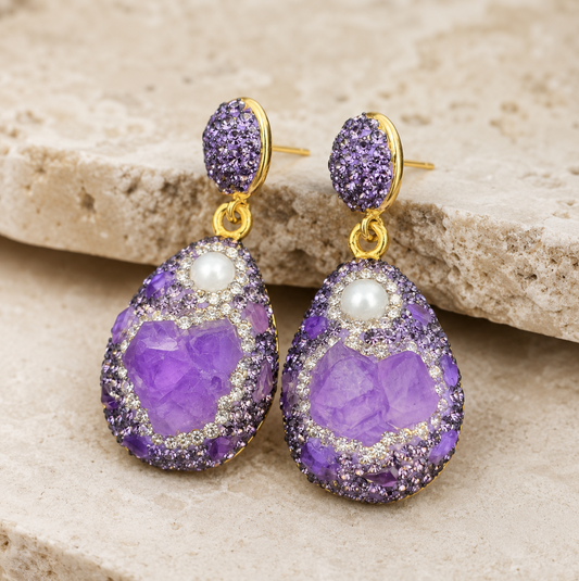 Amethyst earrings with raw purple crystal drops, pearl accents, and gold-tone French-inspired details.
