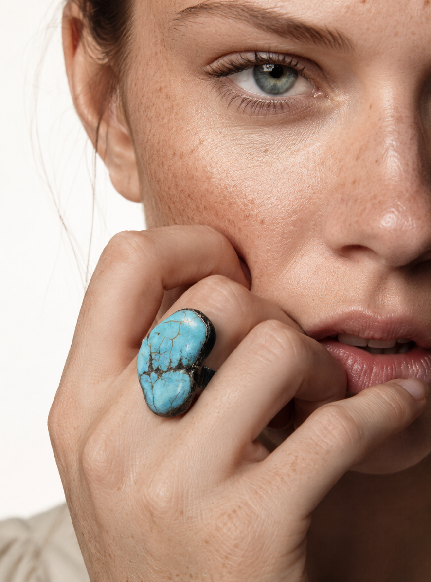 Boho turquoise ring with blue-green stone, organic edges, and artistic everyday jewelry styling.