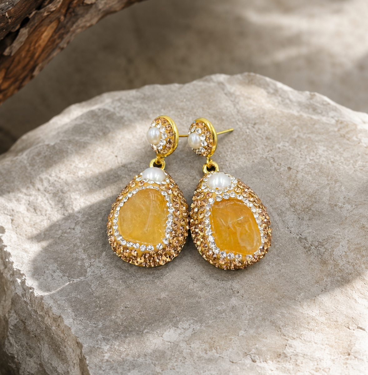 Romantic citrine dangle earrings with warm tone crystal, pearl top detail, and soft luxury styling.