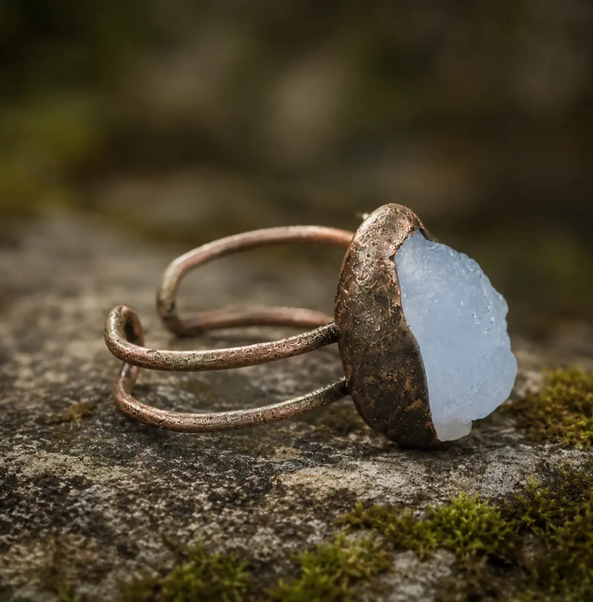 March birthstone ring with pale blue gemstone, organic edges, and understated everyday beauty.