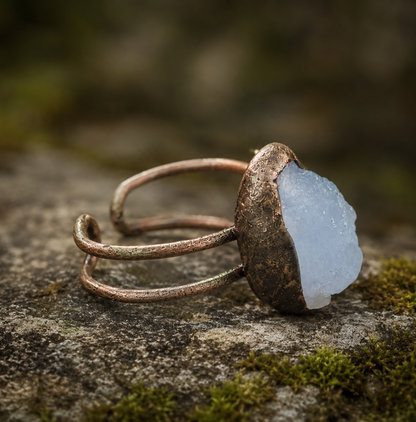 March birthstone ring with pale blue gemstone, organic edges, and understated everyday beauty.