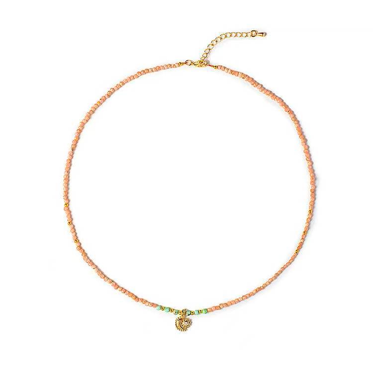 Pink quartz beaded necklace with a gold sun and moon pendant, designed for lucky energy and memorial gifts.